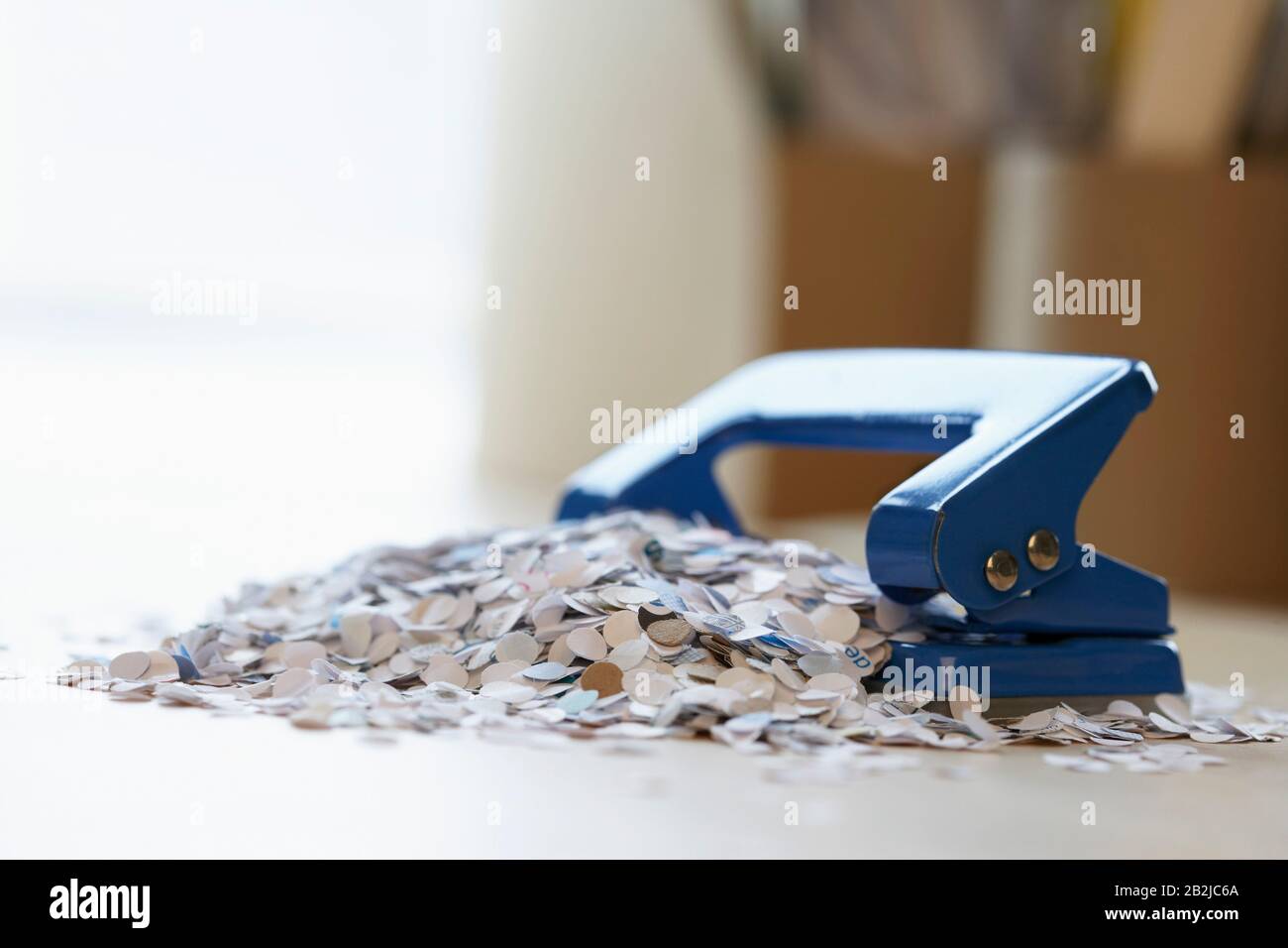 Paper Bits by Hole Punch Stock Photo - Alamy