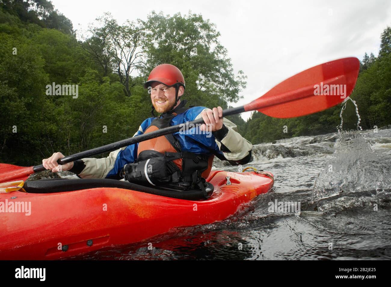 Man kayaking in river portrait Stock Photo