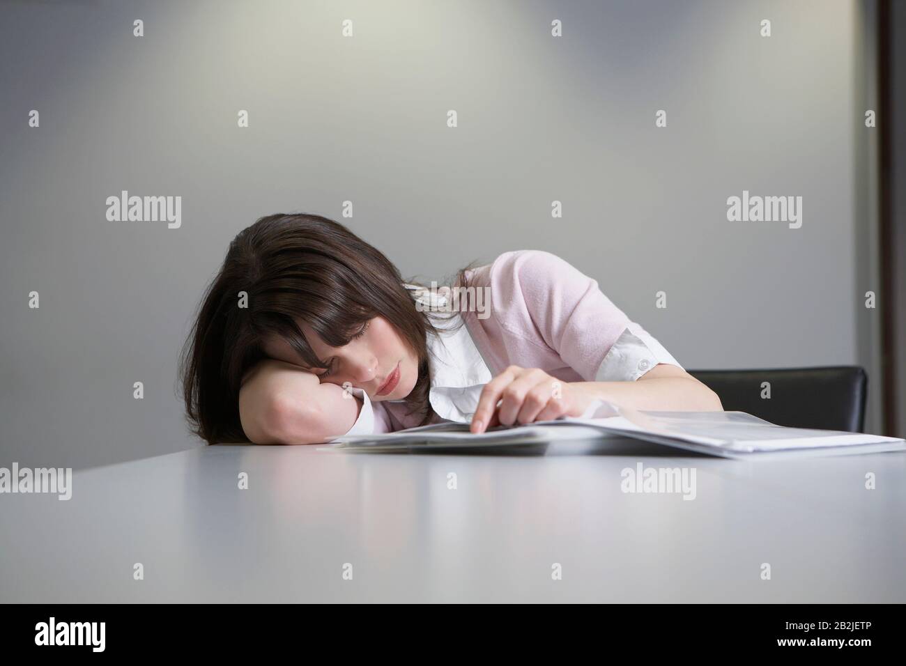 Woman sleeping on desk hi-res stock photography and images - Alamy