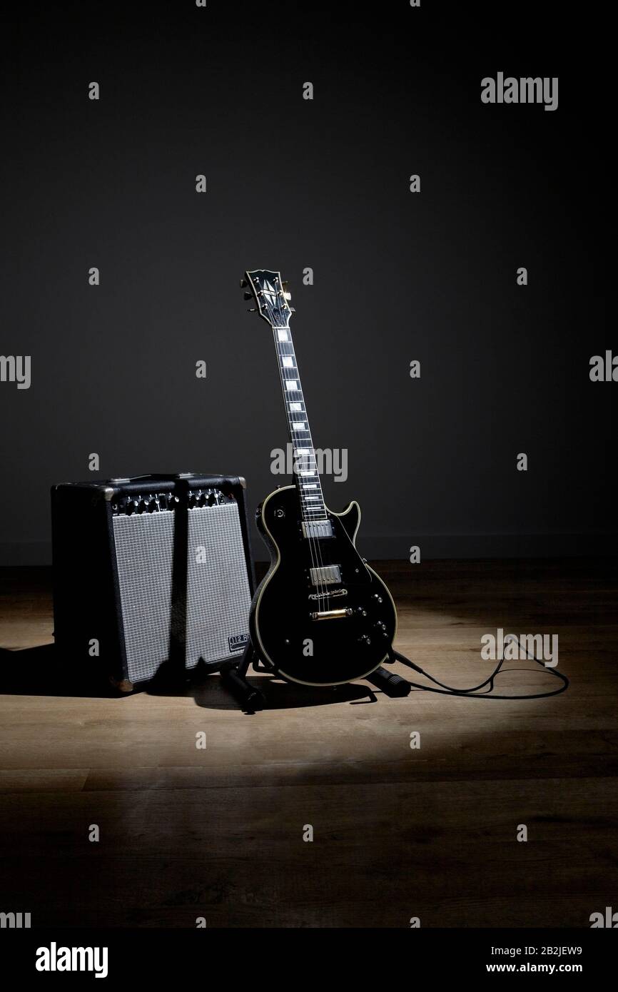 Electric guitar and amplifier on stage Stock Photo Alamy