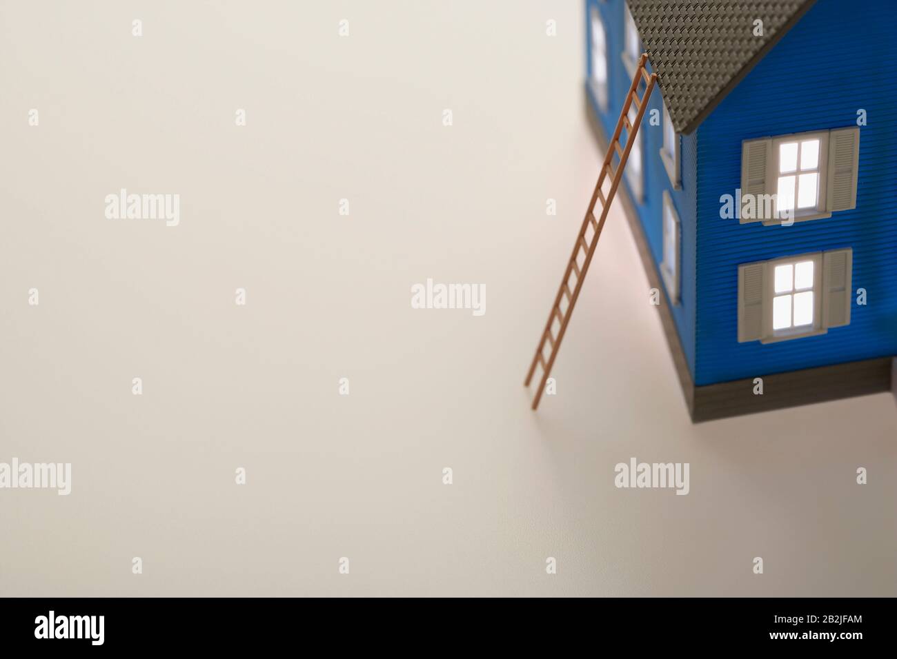 Model of house with ladder Stock Photo - Alamy