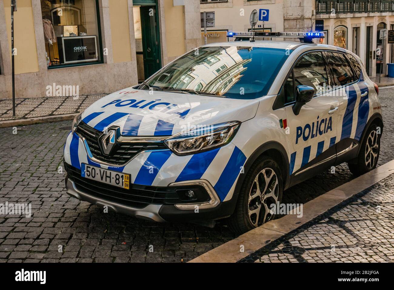 police car parked on the road in lisbon portugal Stock Photo - Alamy