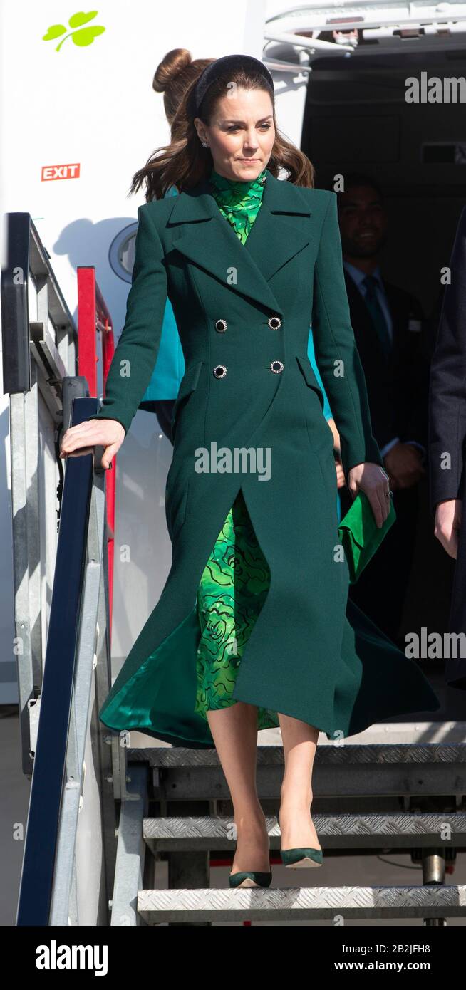The Duchess of Cambridge walks down the steps of the plane as she arrives at Dublin International Airport ahead of a three day visit to the Republic of Ireland. Stock Photo
