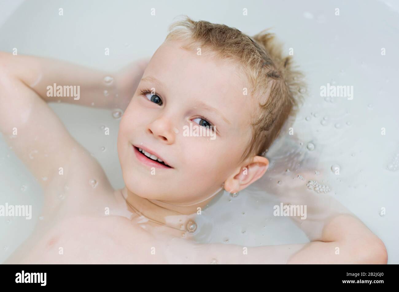 Little Boy Floating in Bathtub Stock Photo Alamy