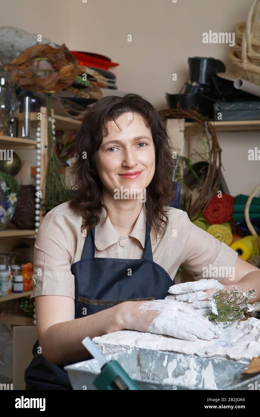 Female artist working in studio portrait Stock Photo - Alamy