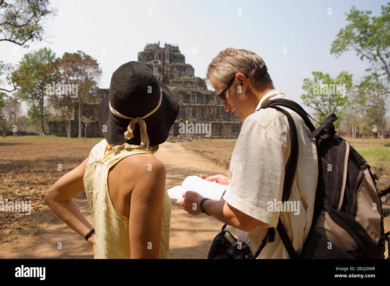 Tourists Looking at at Temple Ruins Stock Photo