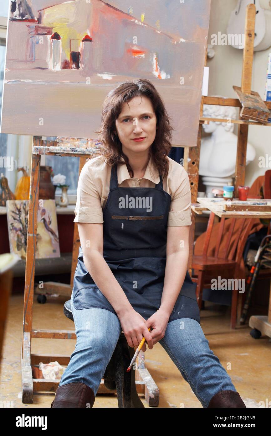 Portrait of woman in painting studio Stock Photo Alamy
