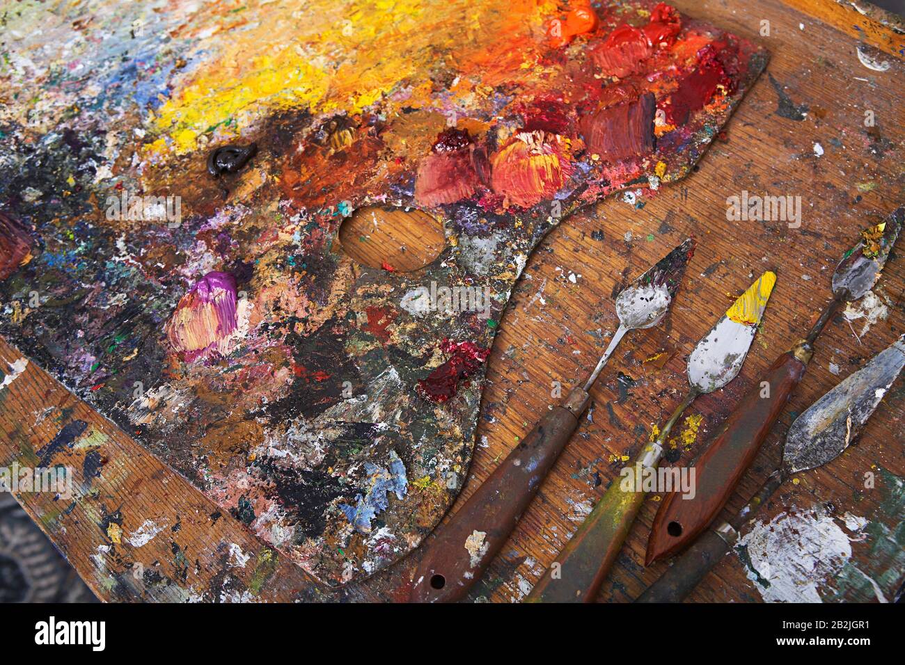 Artist's Palette and Palette Knives Covered in Paint Stock Photo Alamy