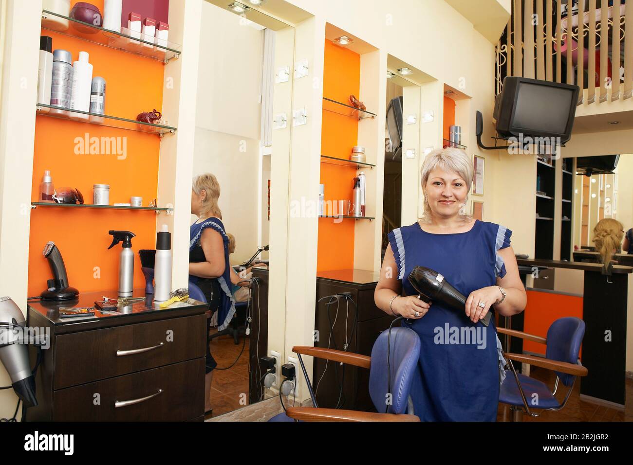 Hairstylist in Beauty Salon Stock Photo
