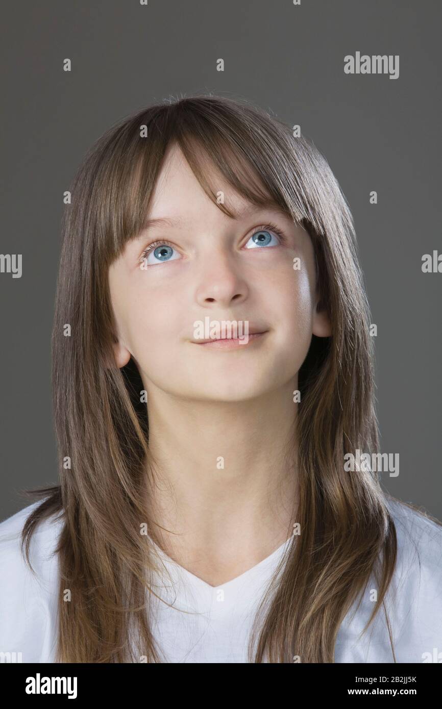 Studio portrait of girl smiling Stock Photo - Alamy