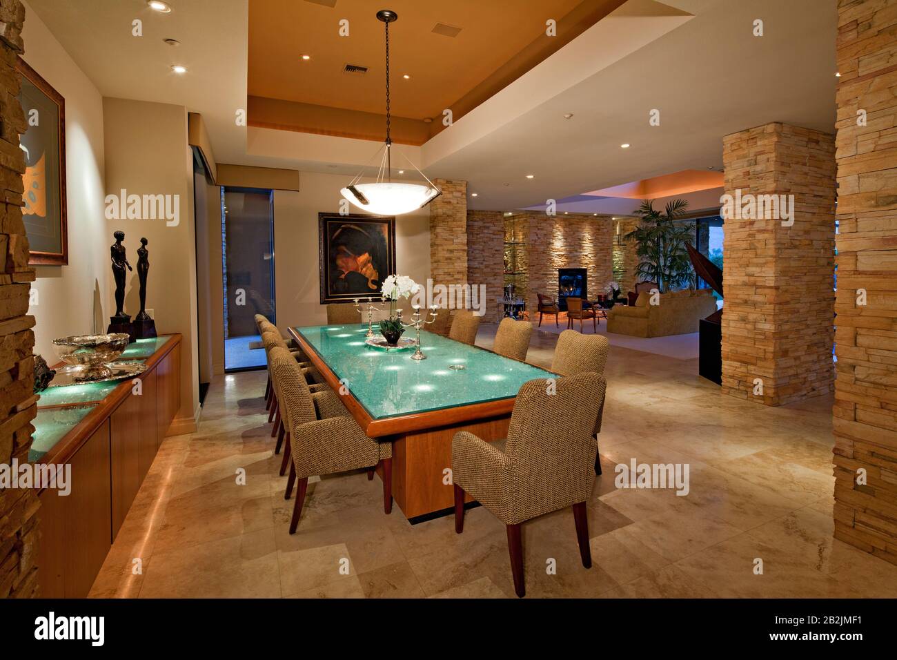 Dining room with chandelier in luxury mansion Stock Photo - Alamy