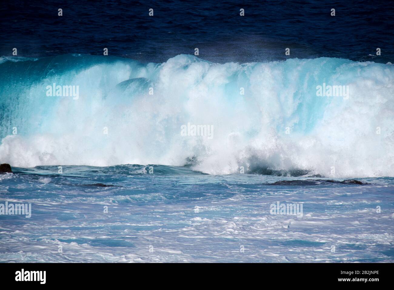 breaking waves crashing in the sea off the shoreline of Lanzarote canary islands spain Stock Photo