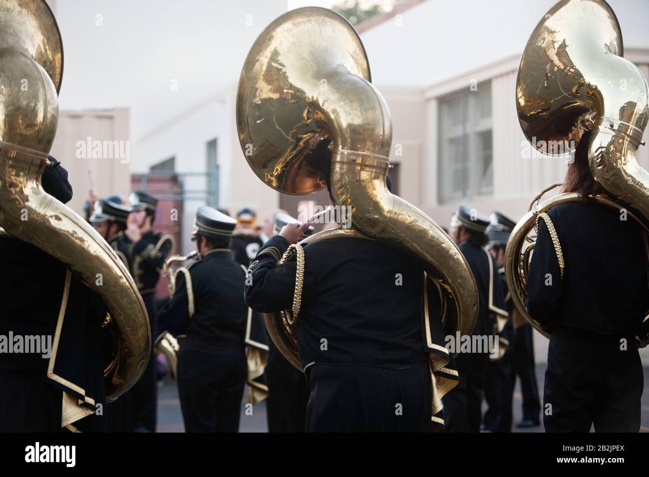 Back view musical group playing sousaphone Stock Photo