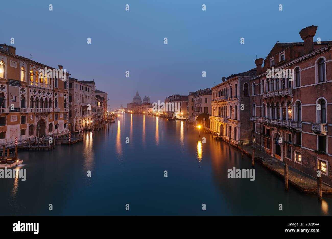 Foggy morning at Grand Canal and in the background the Basilica Santa Maria della Salute,view from Ponte dell' Accademia bridge Stock Photo