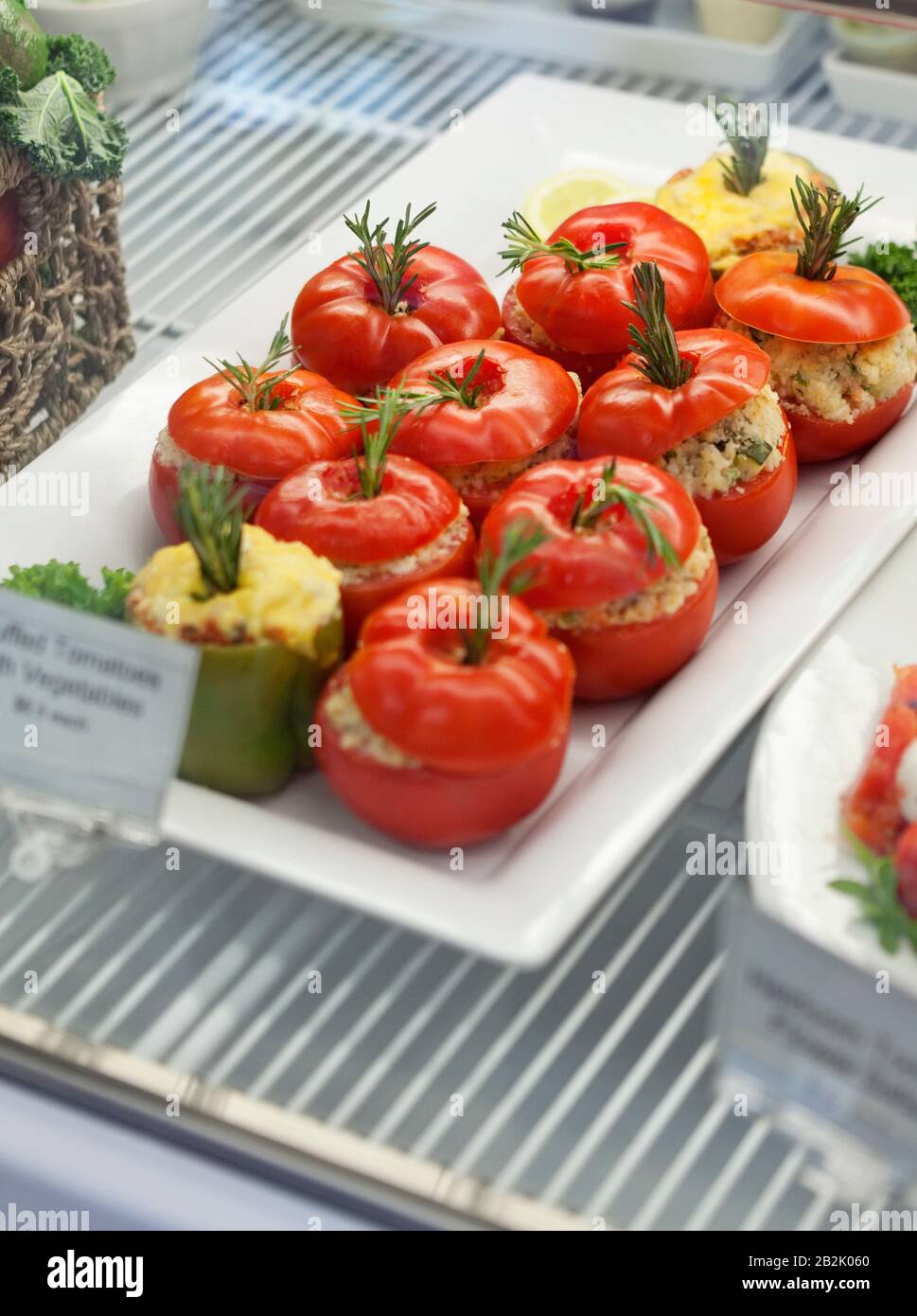 Close-up of stuffed tomatoes in serving dish Stock Photo