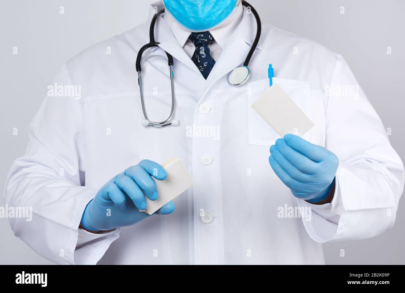 adult doctor therapist is dressed in a white robe uniform and blue ...