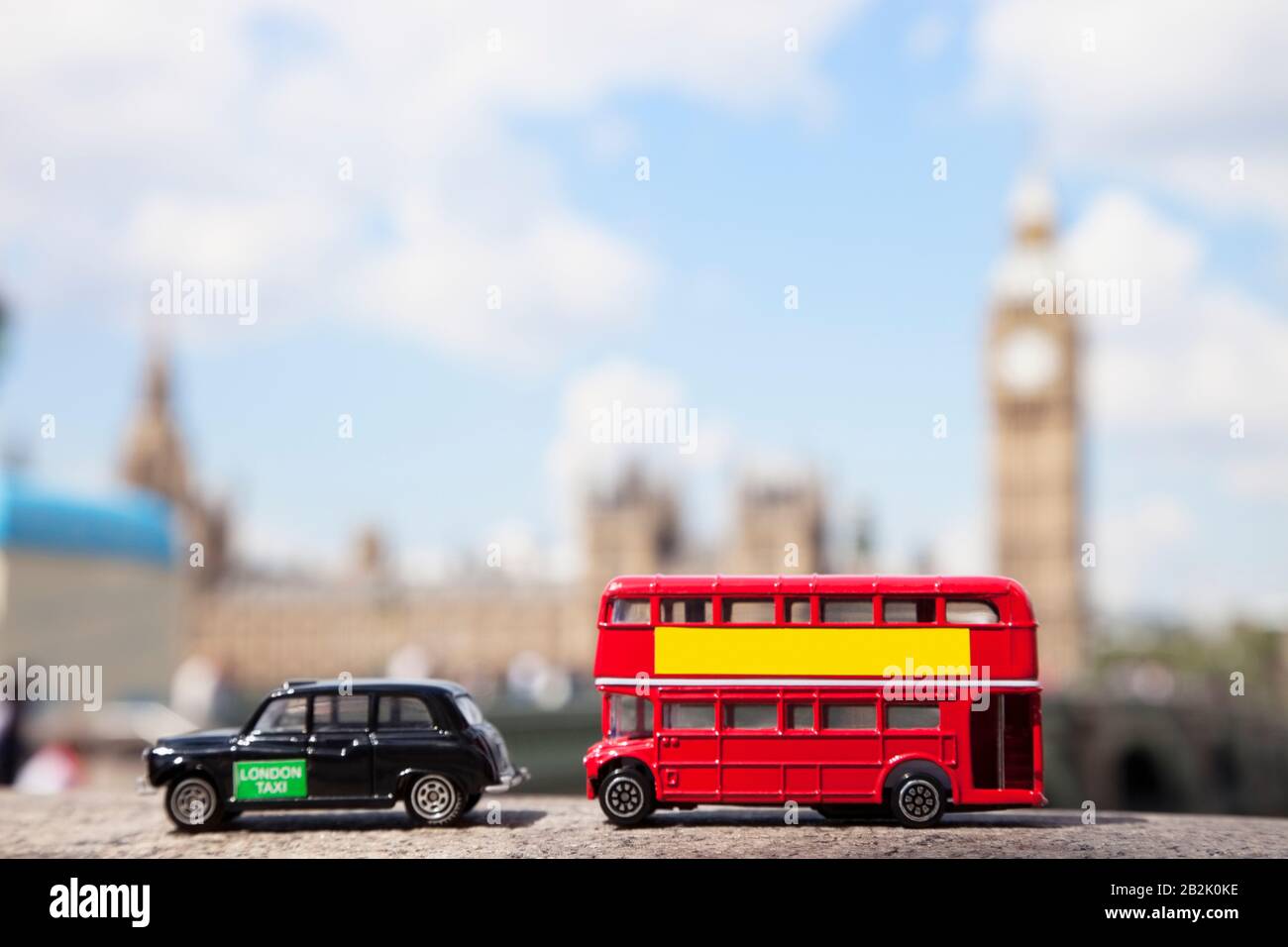 Public transport figurines with Big Ben Tower in the background Stock Photo