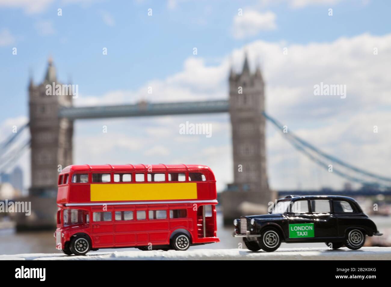 Close-up view of public transport figurines with London Bridge in the background Stock Photo