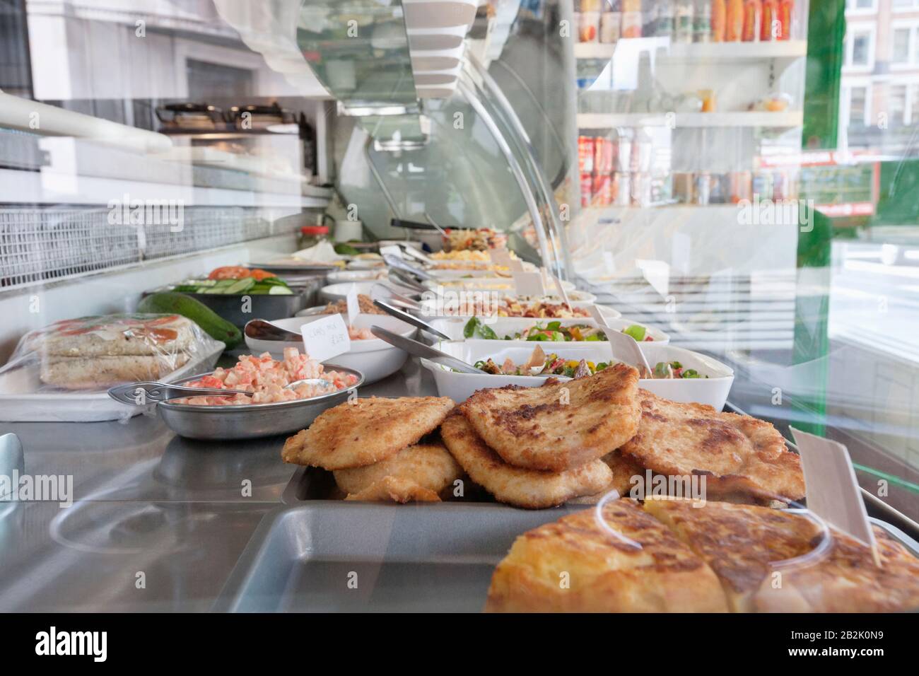 Variety of dishes in display case Stock Photo Alamy