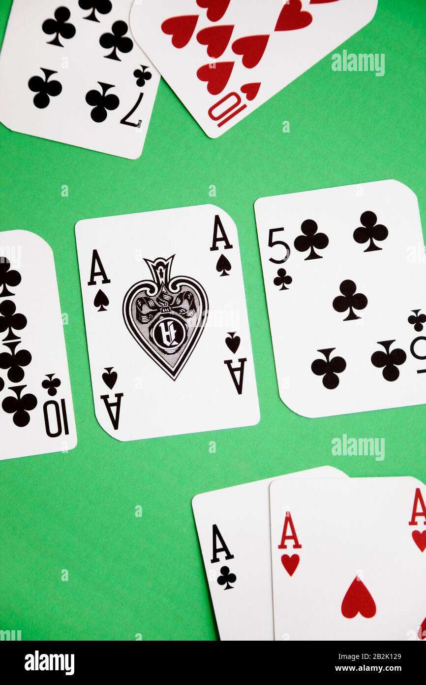 High angle view of a playing cards on green surface Stock Photo