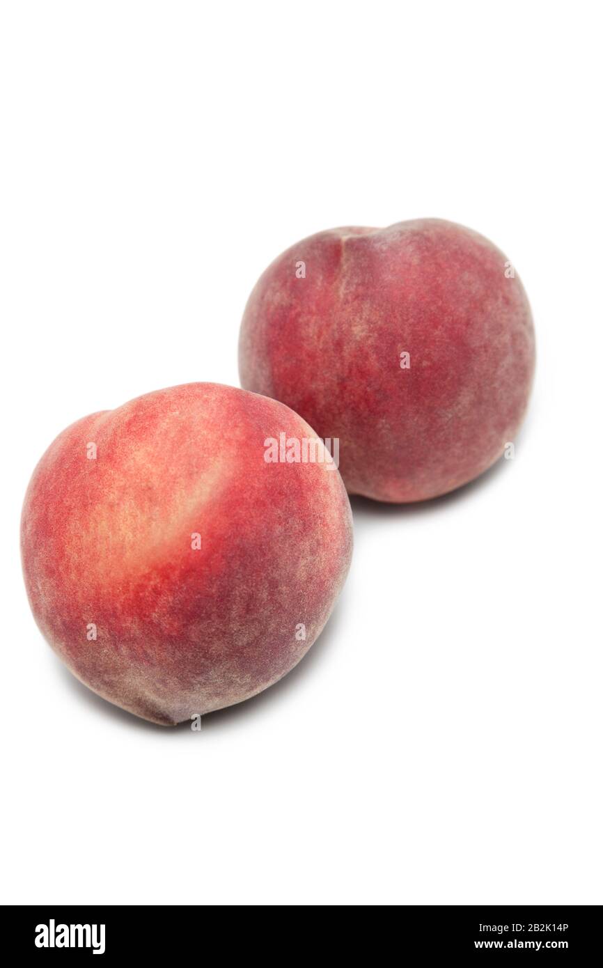 Two peaches against white background Stock Photo