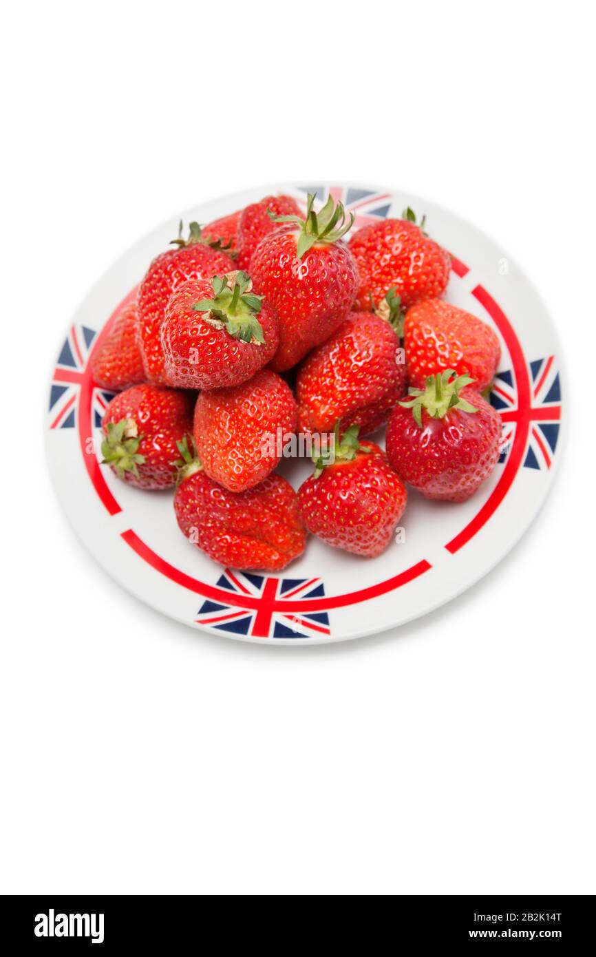 Fresh strawberries in plate over white background Stock Photo - Alamy