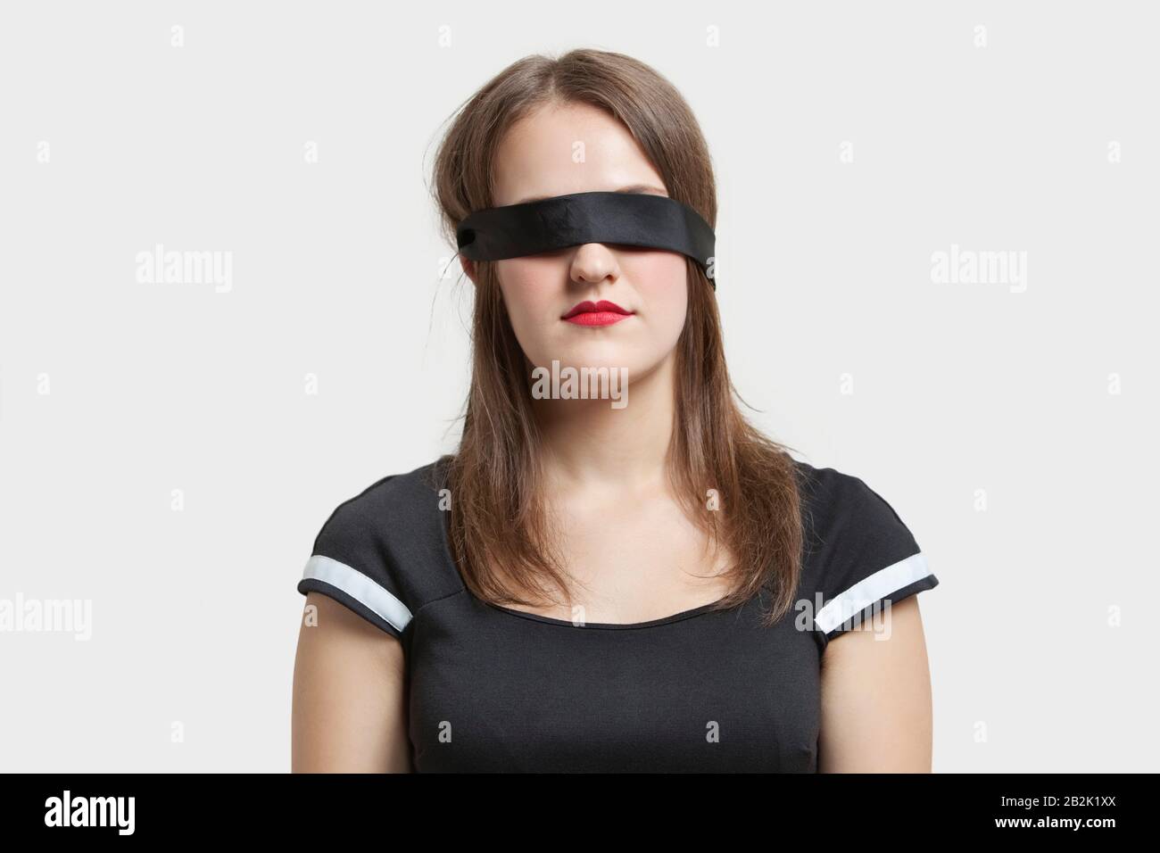 Young Woman Wearing Black Blindfold Isolated On Grey Stock Photo, Picture  and Royalty Free Image. Image 114818746.