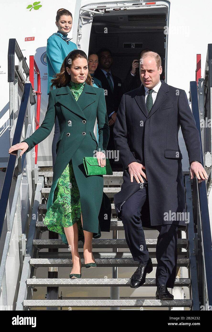 The Duke and Duchess of Cambridge walk down the steps of the plane as they arrive at Dublin International Airport ahead of their three day visit to the Republic of Ireland. Stock Photo