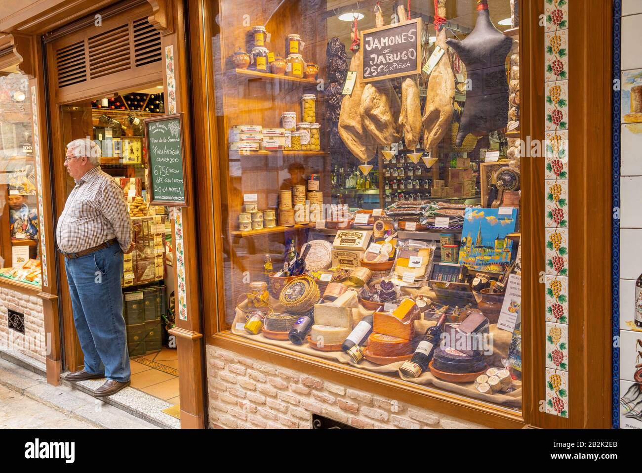 Shop owner outside Casa Cuartero, traditional grocery store, Toledo, Spain Stock Photo