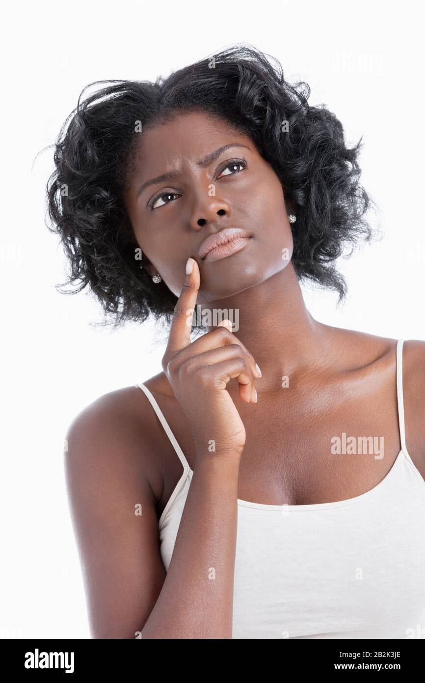 Pensive young african woman thinking hi-res stock photography and ...