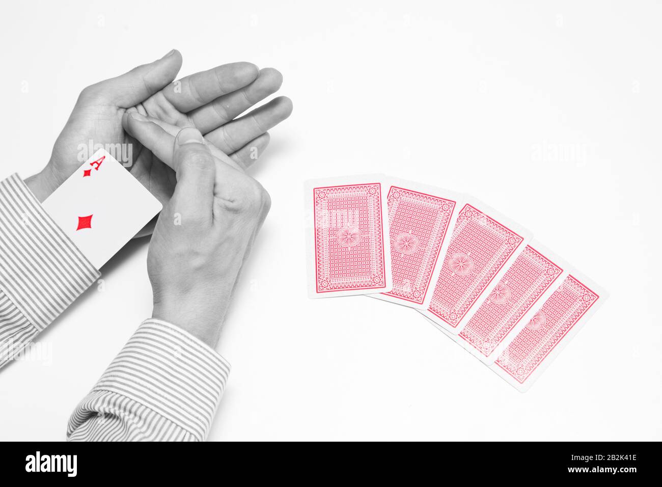 Poker player with Ace up his sleeve Stock Photo
