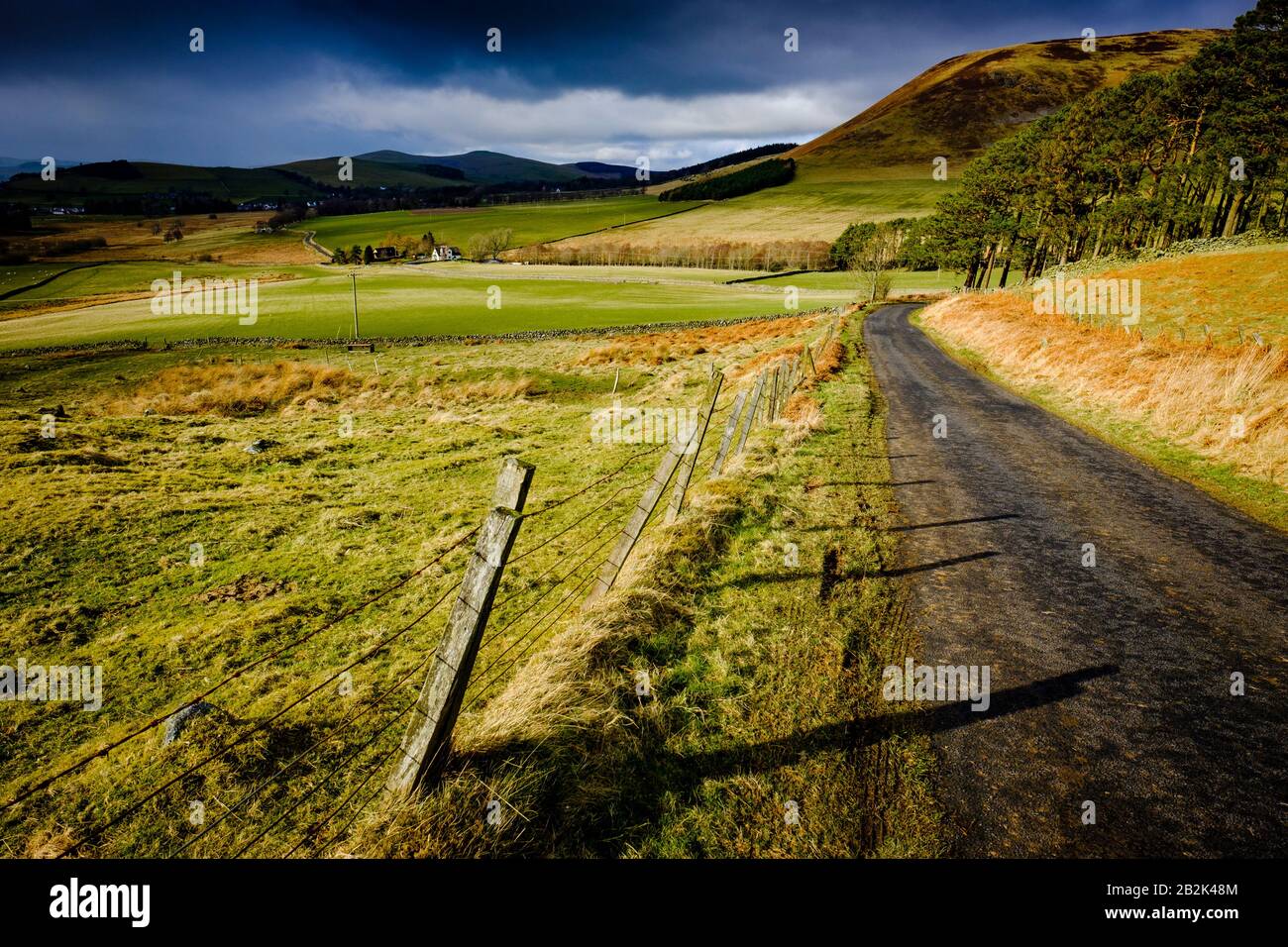 Rain and sunshine in the Scottish Borders looking towards the village of Broughton. Stock Photo