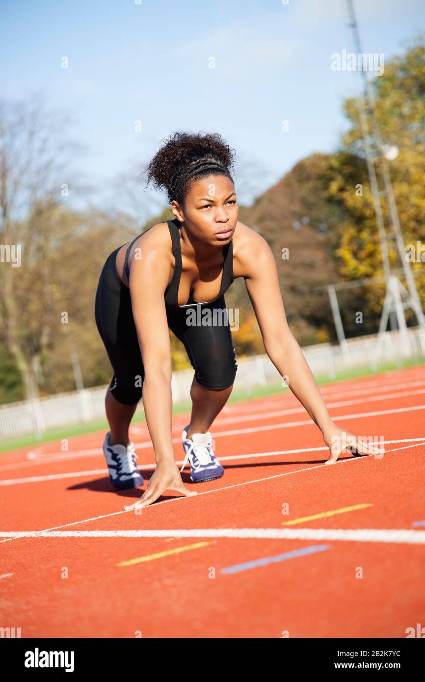 African American female runner at the starting line Stock Photo - Alamy