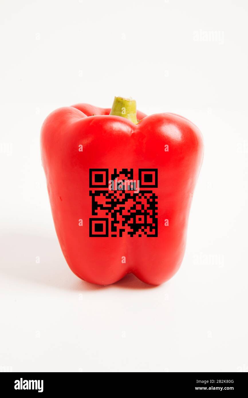 Close-up of red bell pepper with bar code over white background Stock Photo