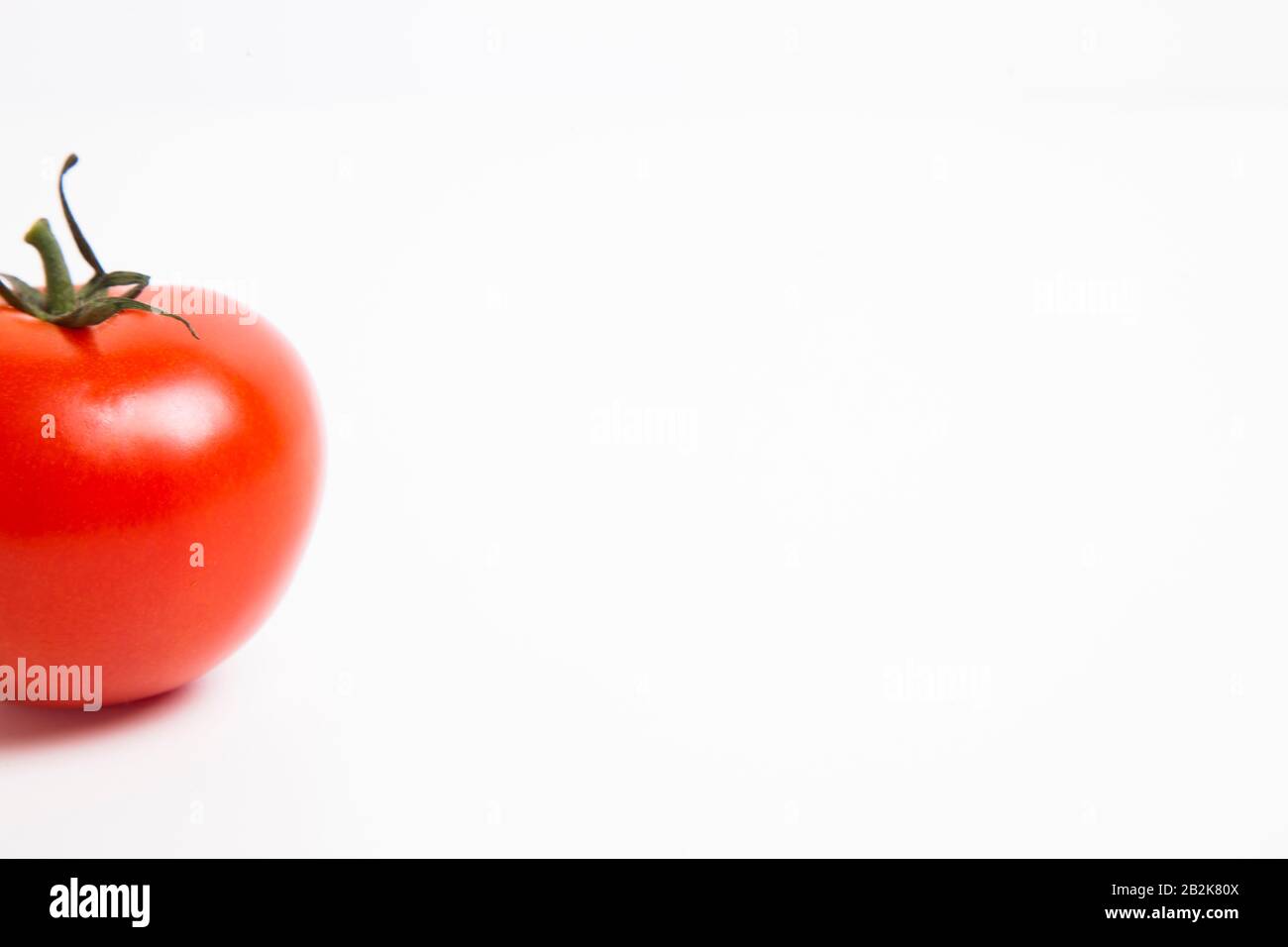 Cropped shot of tomato over white background Stock Photo