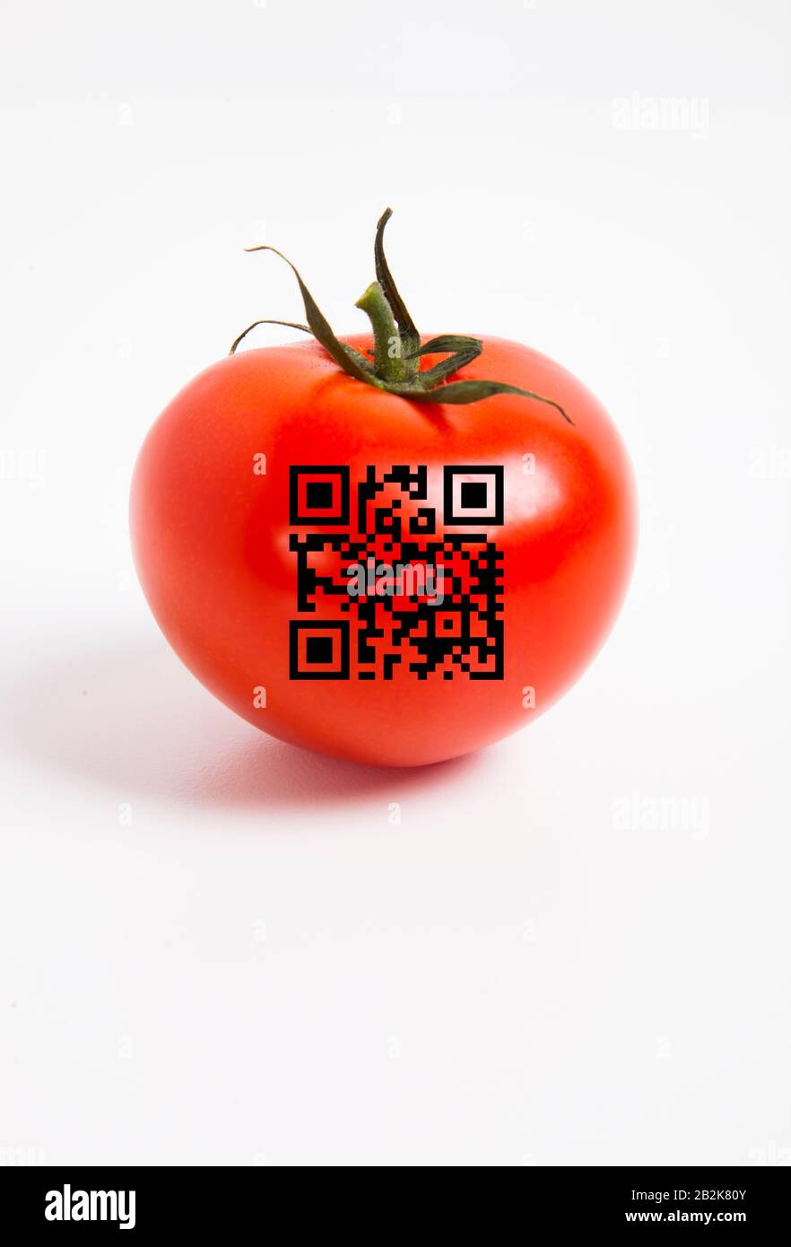 Close-up of tomato with bar code over white background Stock Photo