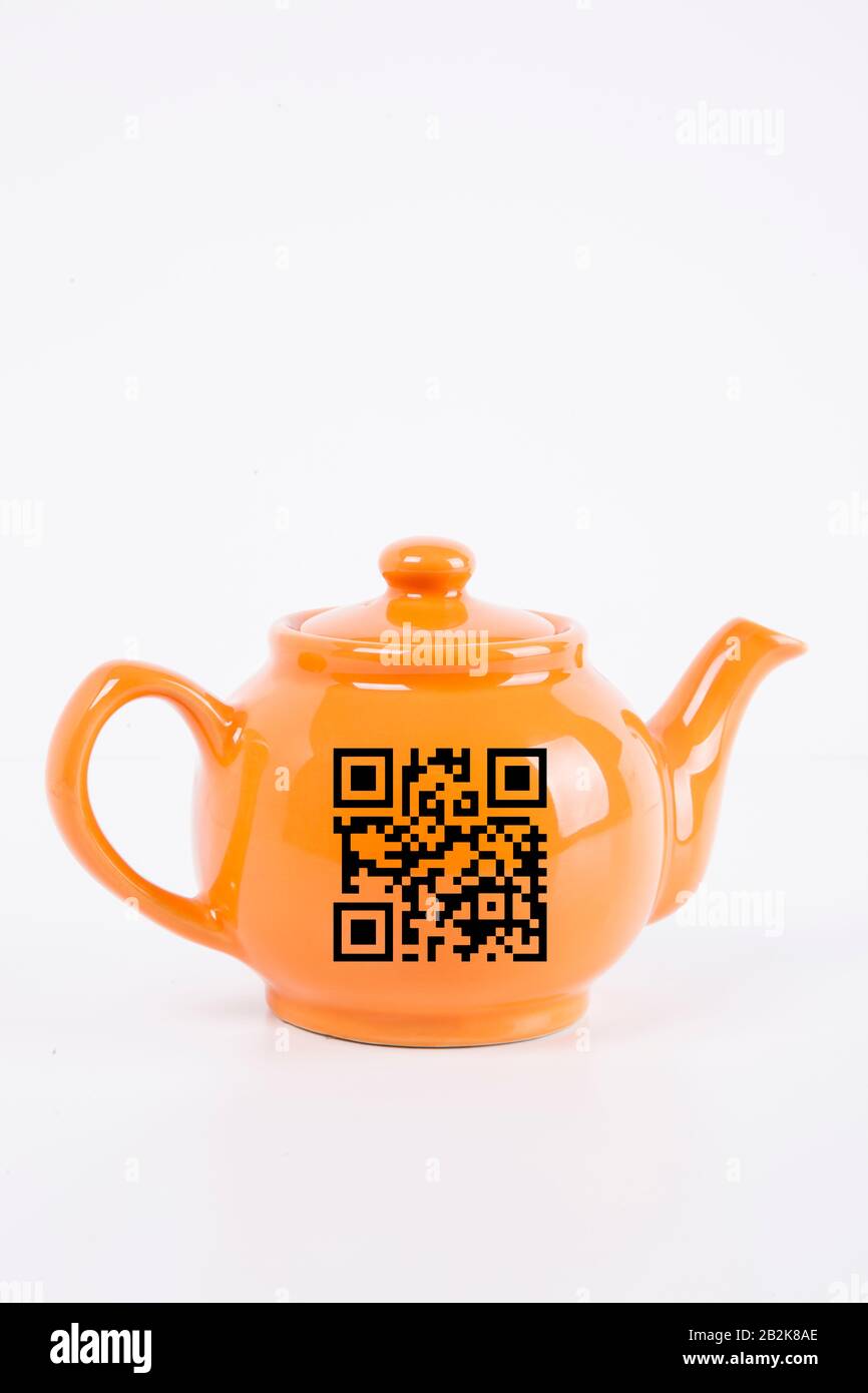 Close-up of orange kettle with barcode over white background Stock Photo