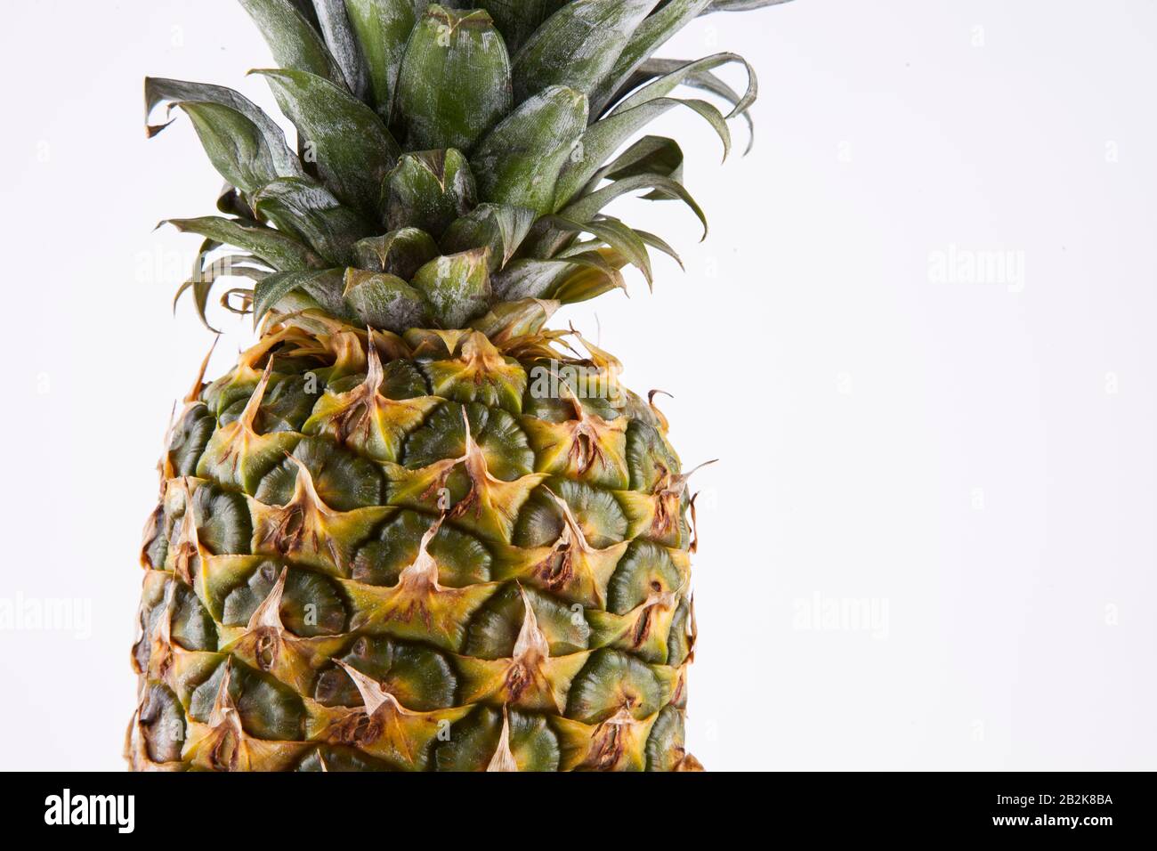 Close-up of fresh pineapple over white background Stock Photo