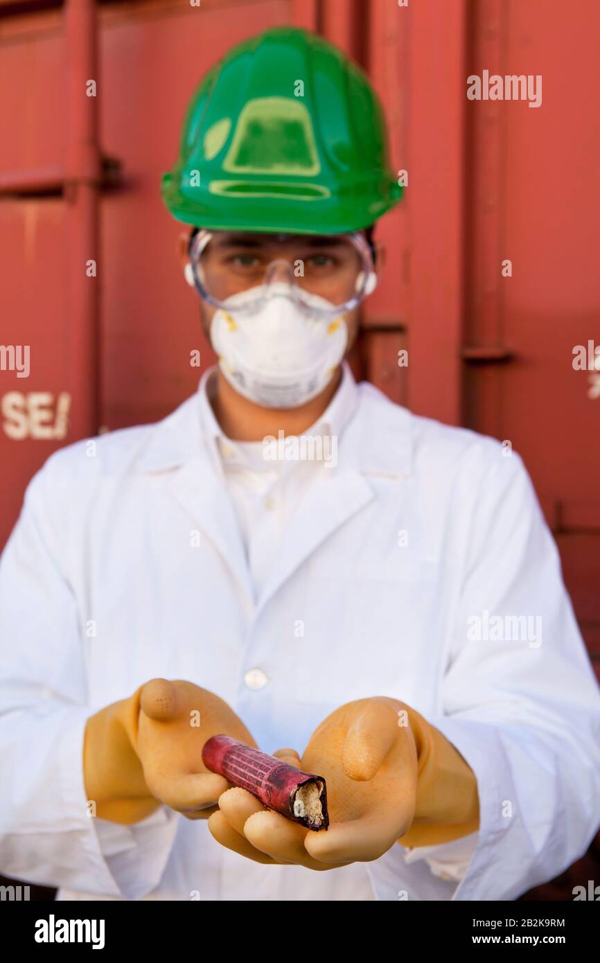 Safety inspector holding explosive material Stock Photo