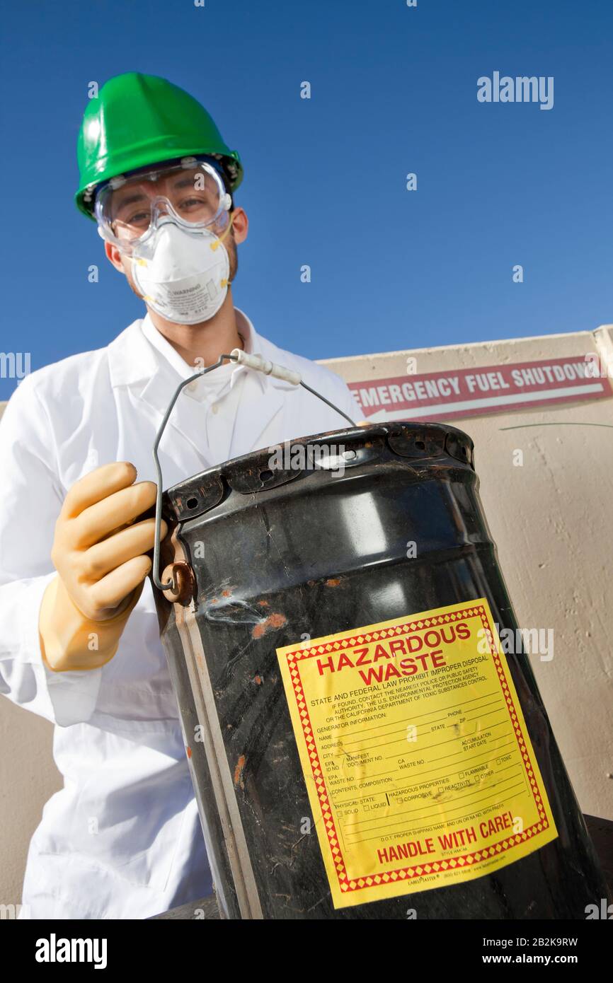 Safety inspector holding hazardous waste Stock Photo