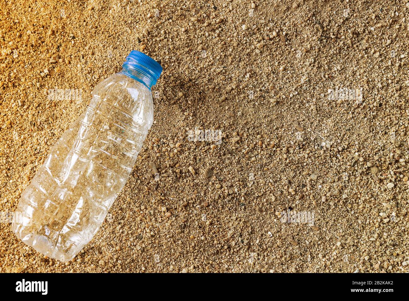 Plastic water bottles pollution in beach. Environment concept Stock