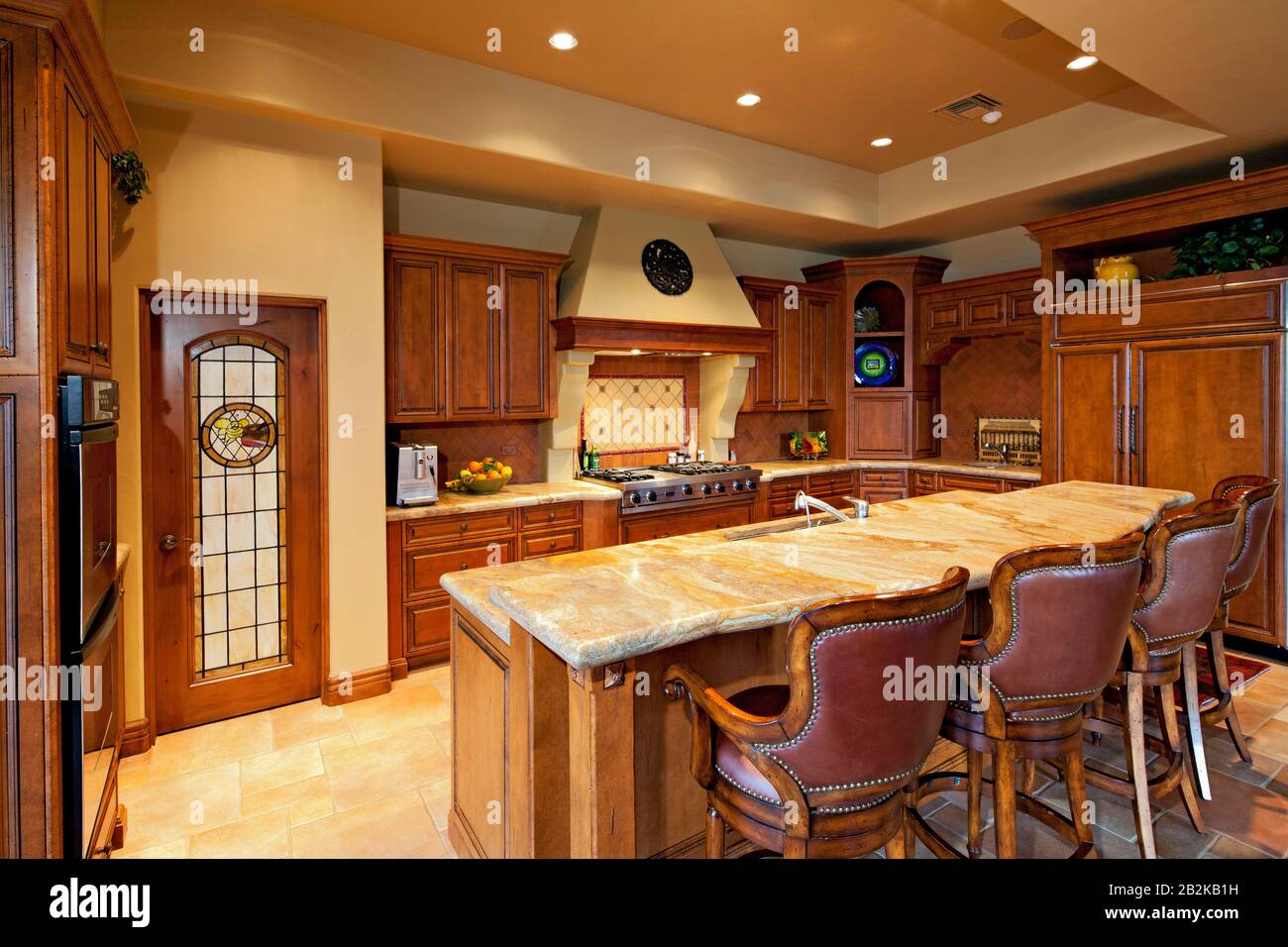 Large kitchen with breakfast bar Stock Photo - Alamy