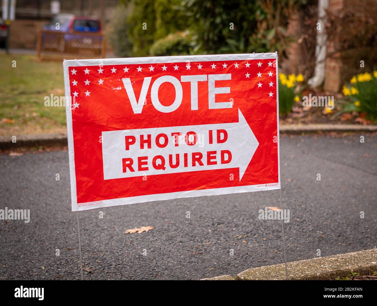 ARLINGTON, VIRGINIA, USA - MARCH 3, 2020: Democratic primary election voting sign, Vote Photo ID Required. Stock Photo
