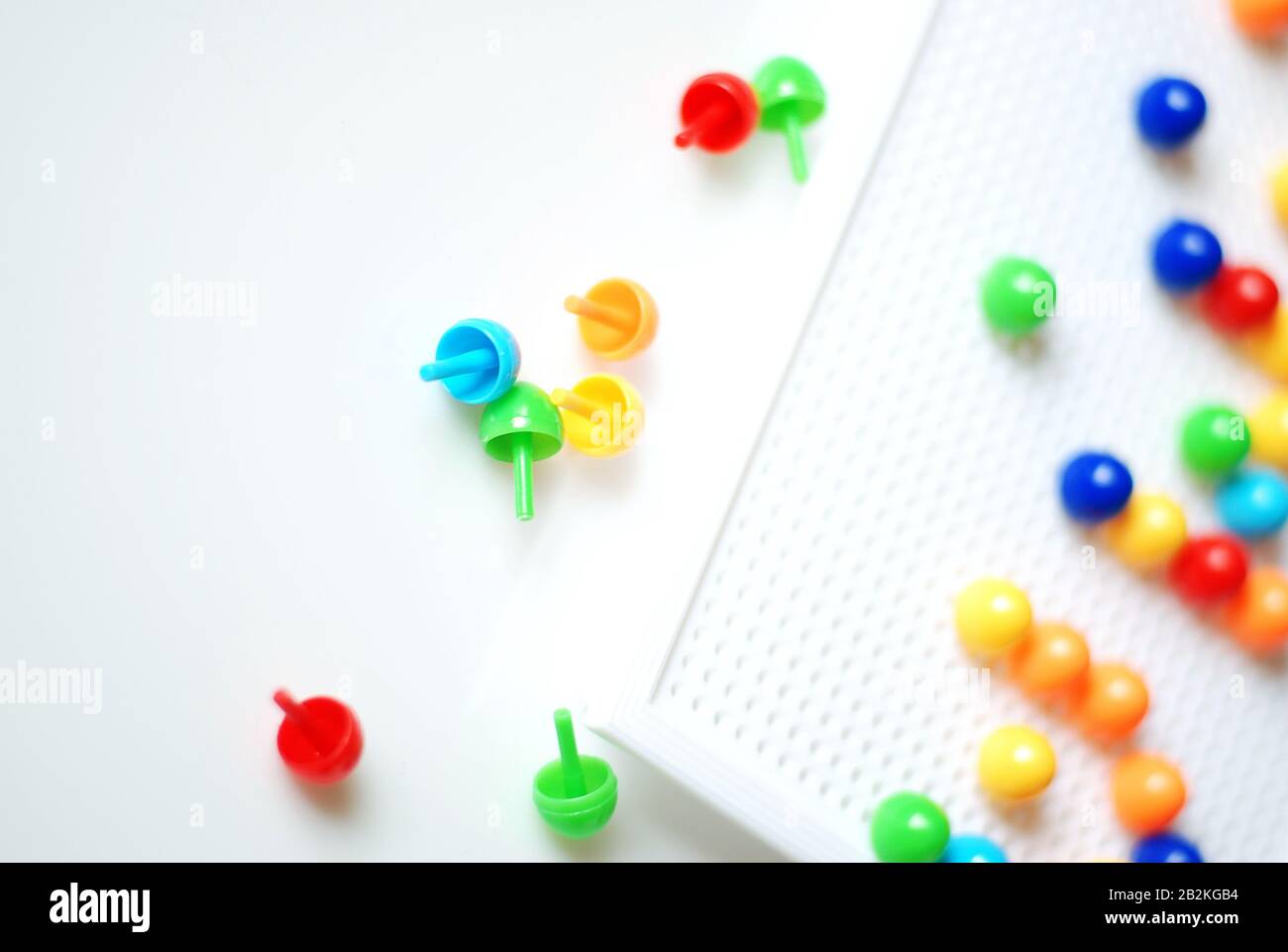 Colorful pin buttons game for kids and learning proposes on white, isolated  background Stock Photo - Alamy
