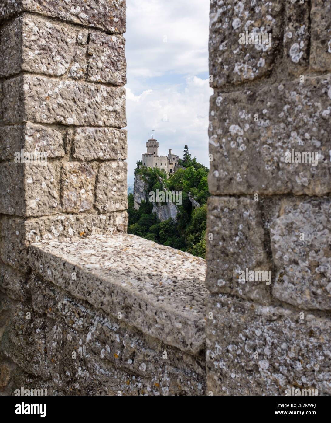 Fortified stone walls and castle towers along the mountains of San Marino in Southern Europe Stock Photo