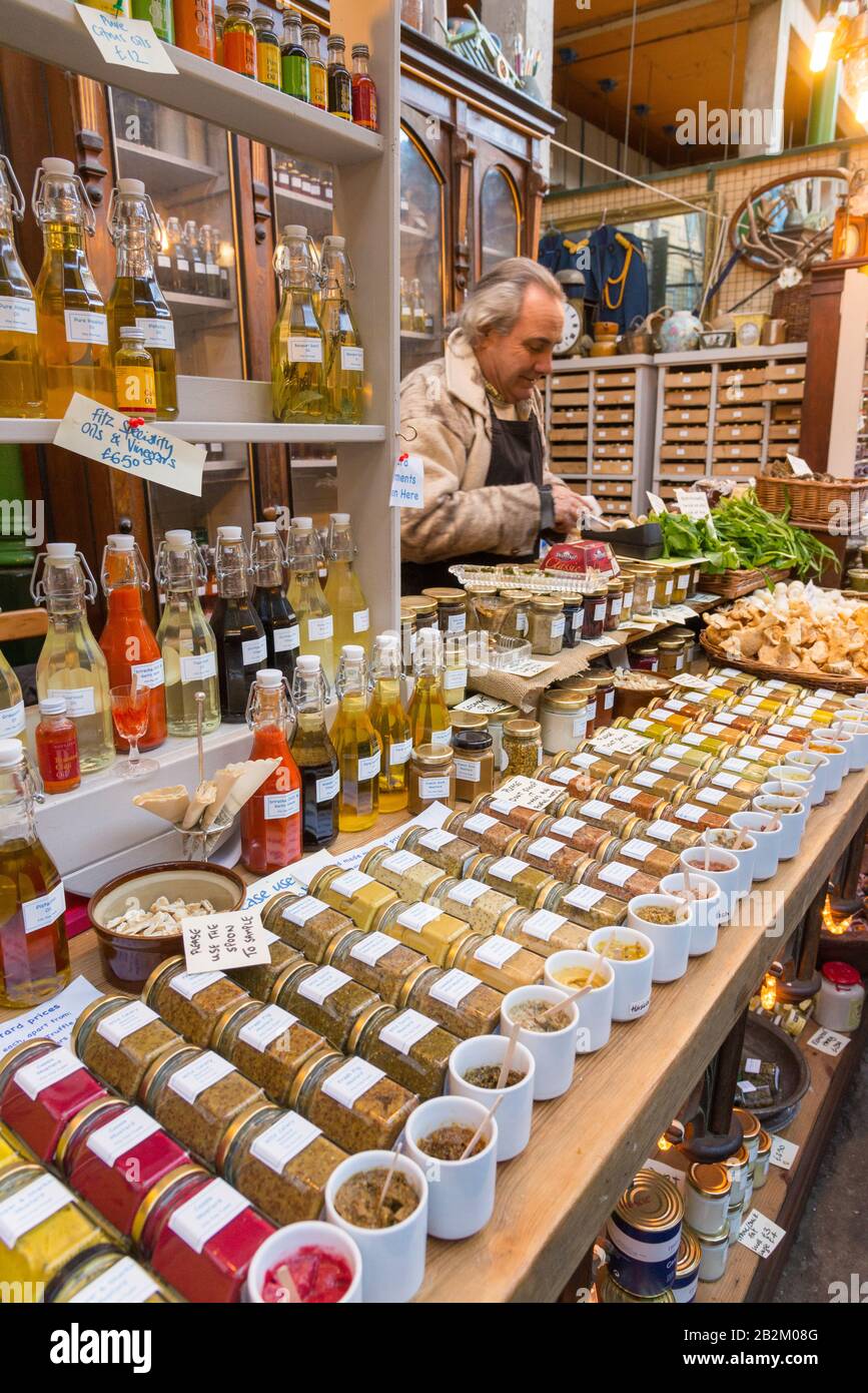 Speciality mustards and other condiments on a stall in Borough Market, London, England, UK Stock Photo