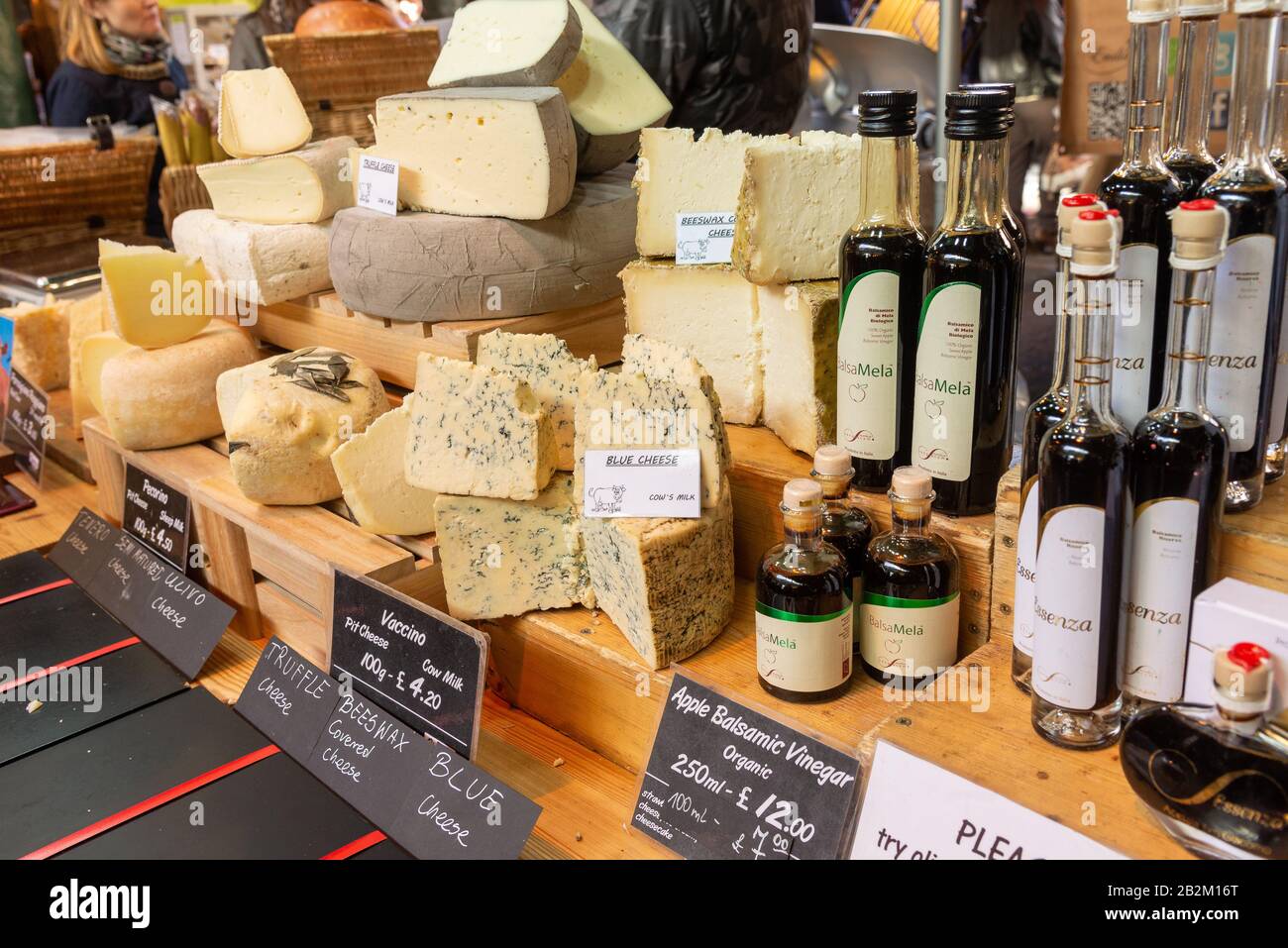 Continental cheeses on a stall in Borough Market, London, UK Stock Photo