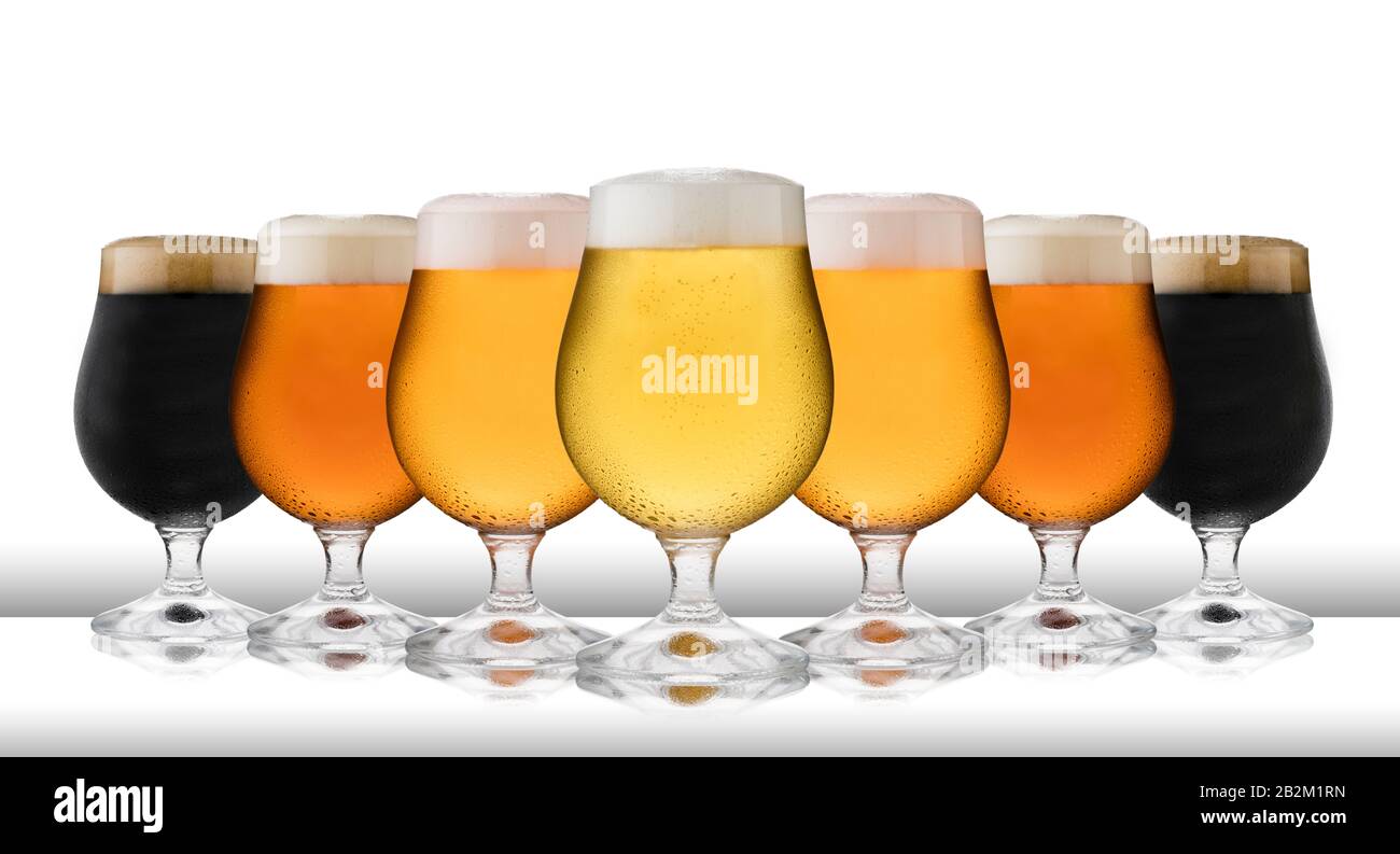 A row of refreshing lager, beer, cider and stout, in schooner glasses