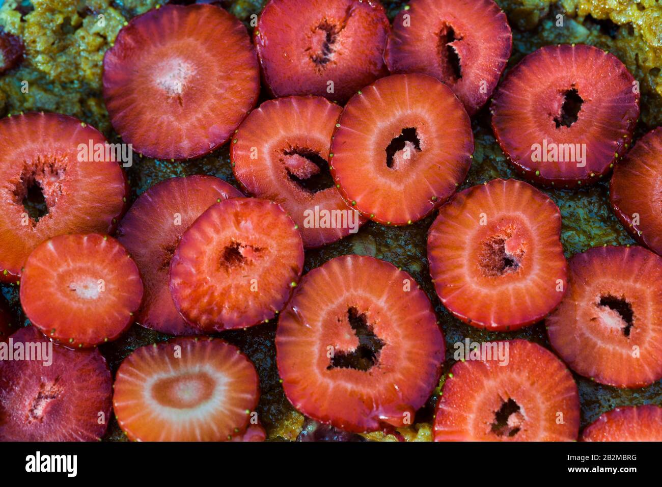 Sliced strawberries on a crumble cake Stock Photo