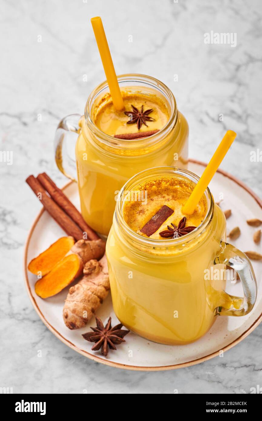 Hadi Doodh Know As Golden Turmeric Milk In Mason Jar On White Marble Background Golden Milk Is Ayurvedic Recipe Of Hot Milk With Turmeric Ginger And Stock Photo Alamy